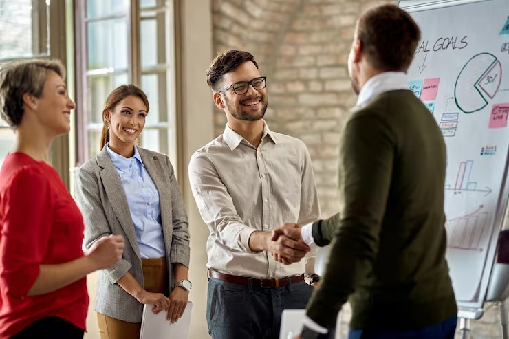 imageye imgi 22 happy coworkes shaking hands after business presentation office 637285 7048